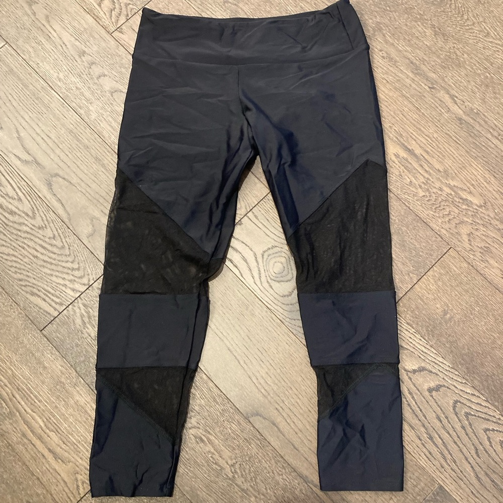 Onzie black mesh 3/4 length leggings, size M/L, in excellent condition.